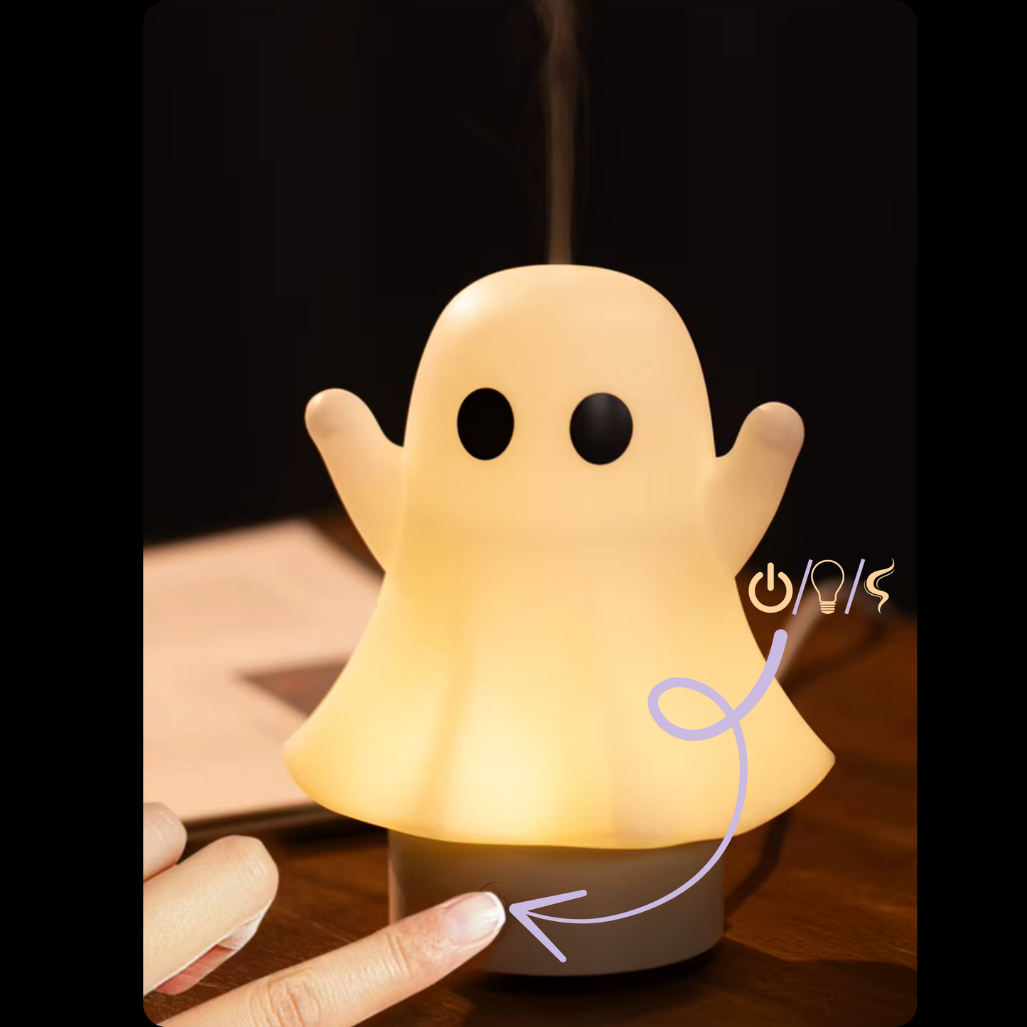 diffuseur aromathérapie avec un doigt appuyant sur le bouton, une flèche indique ses fonction (on/off, lumière et brume)